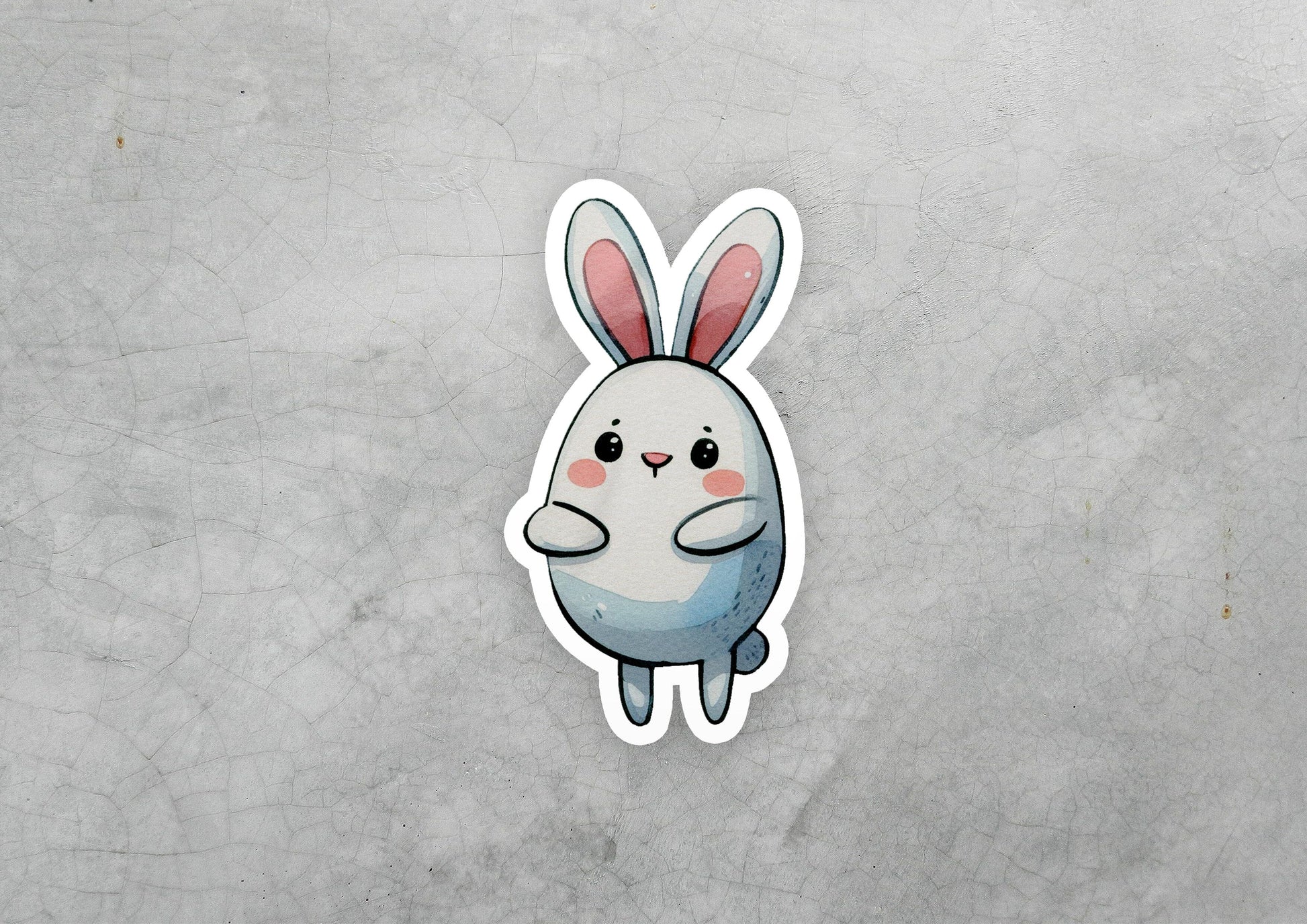 a sticker of a rabbit sitting on top of a table