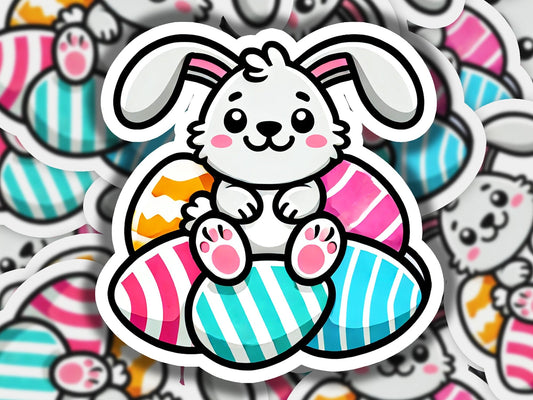 a sticker of a bunny sitting on an easter egg