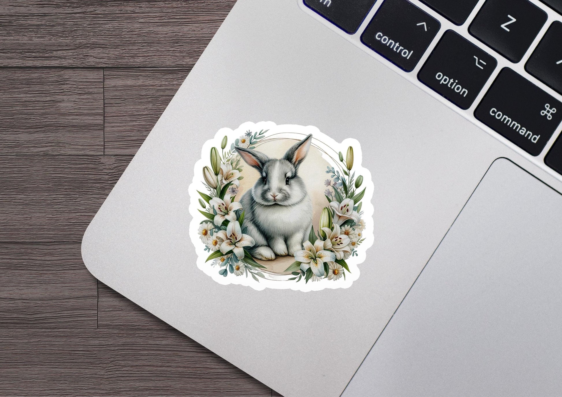 a sticker of a rabbit with flowers on it