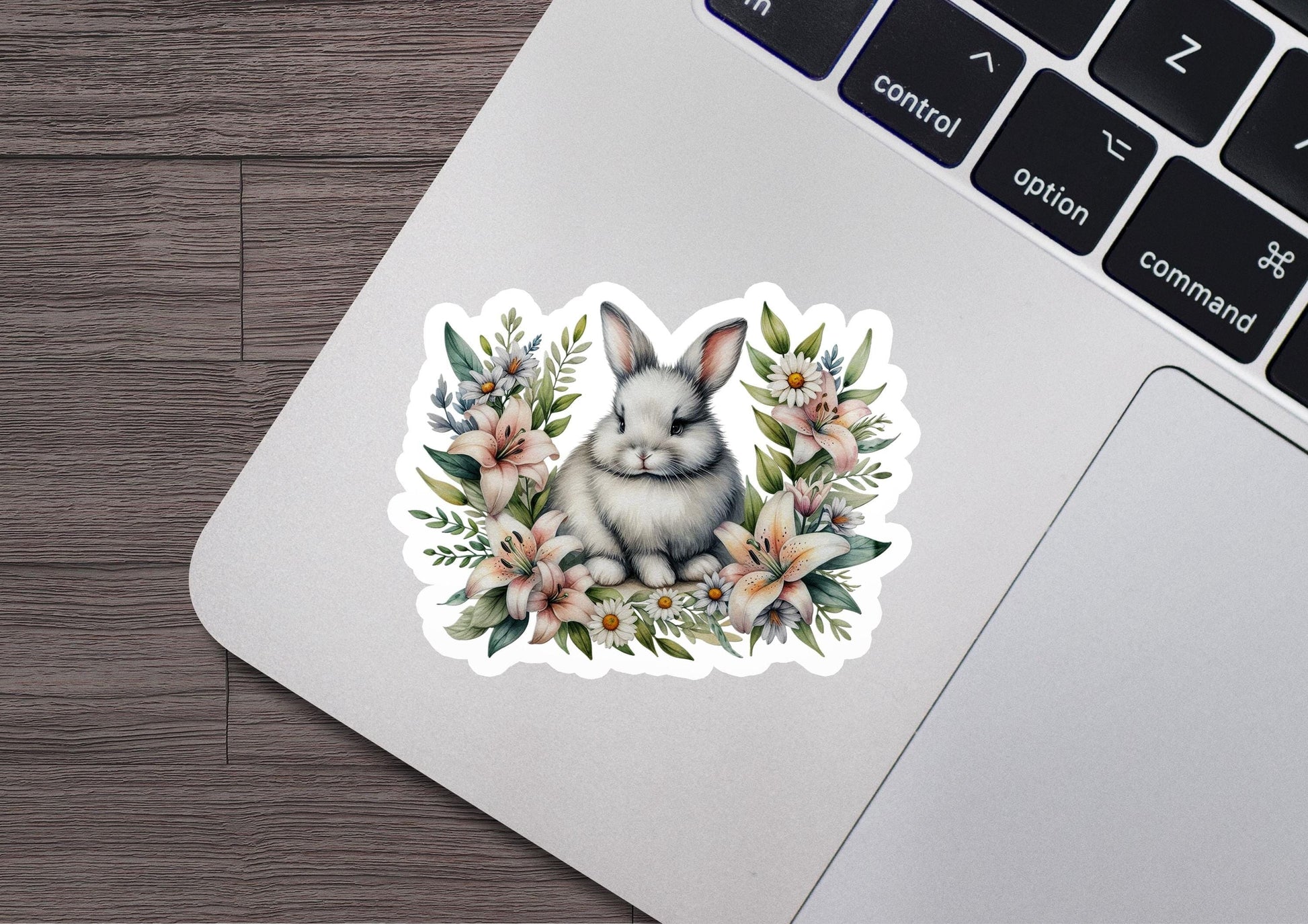 a laptop with a sticker of a rabbit on it