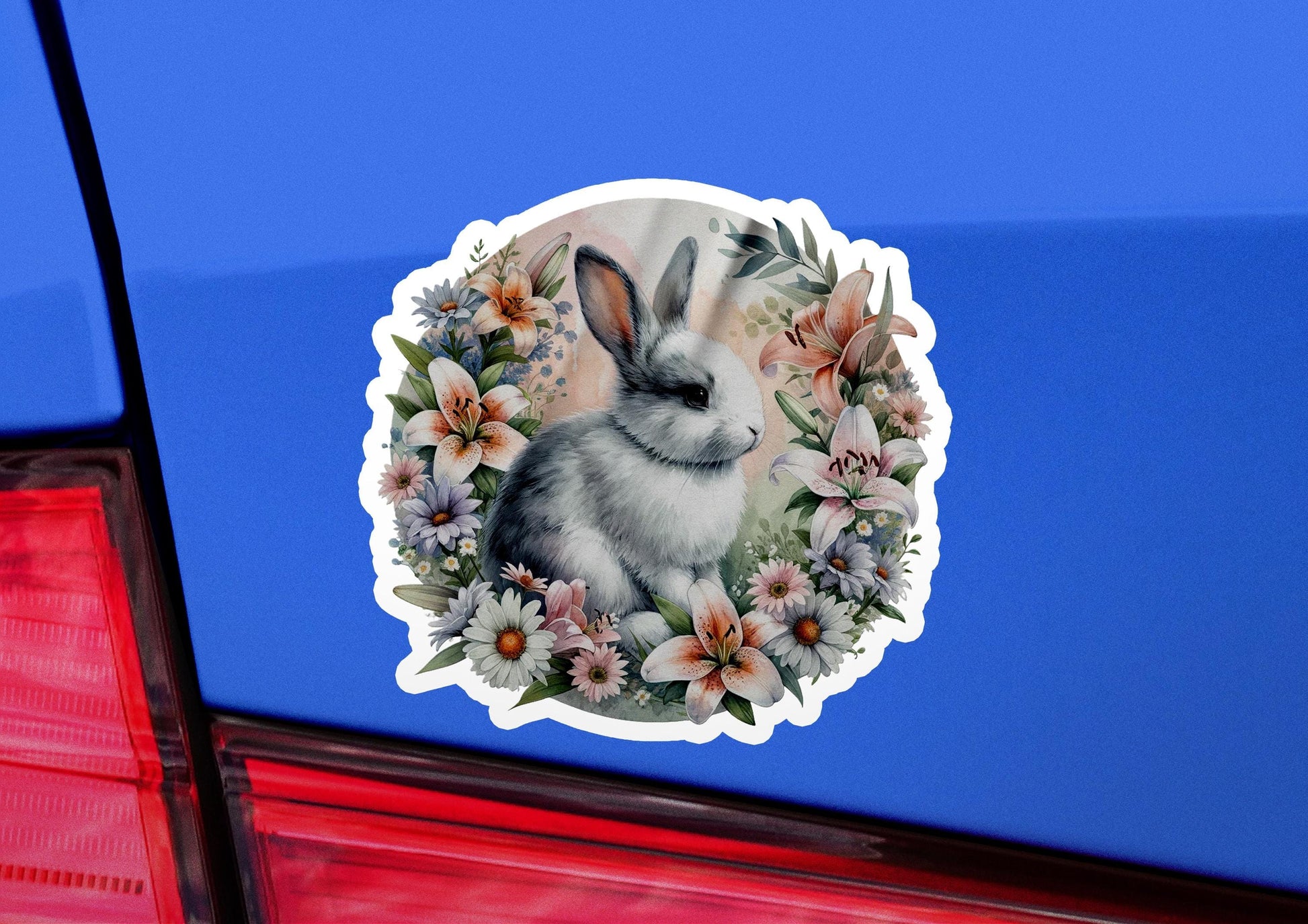 a sticker of a rabbit with flowers on it