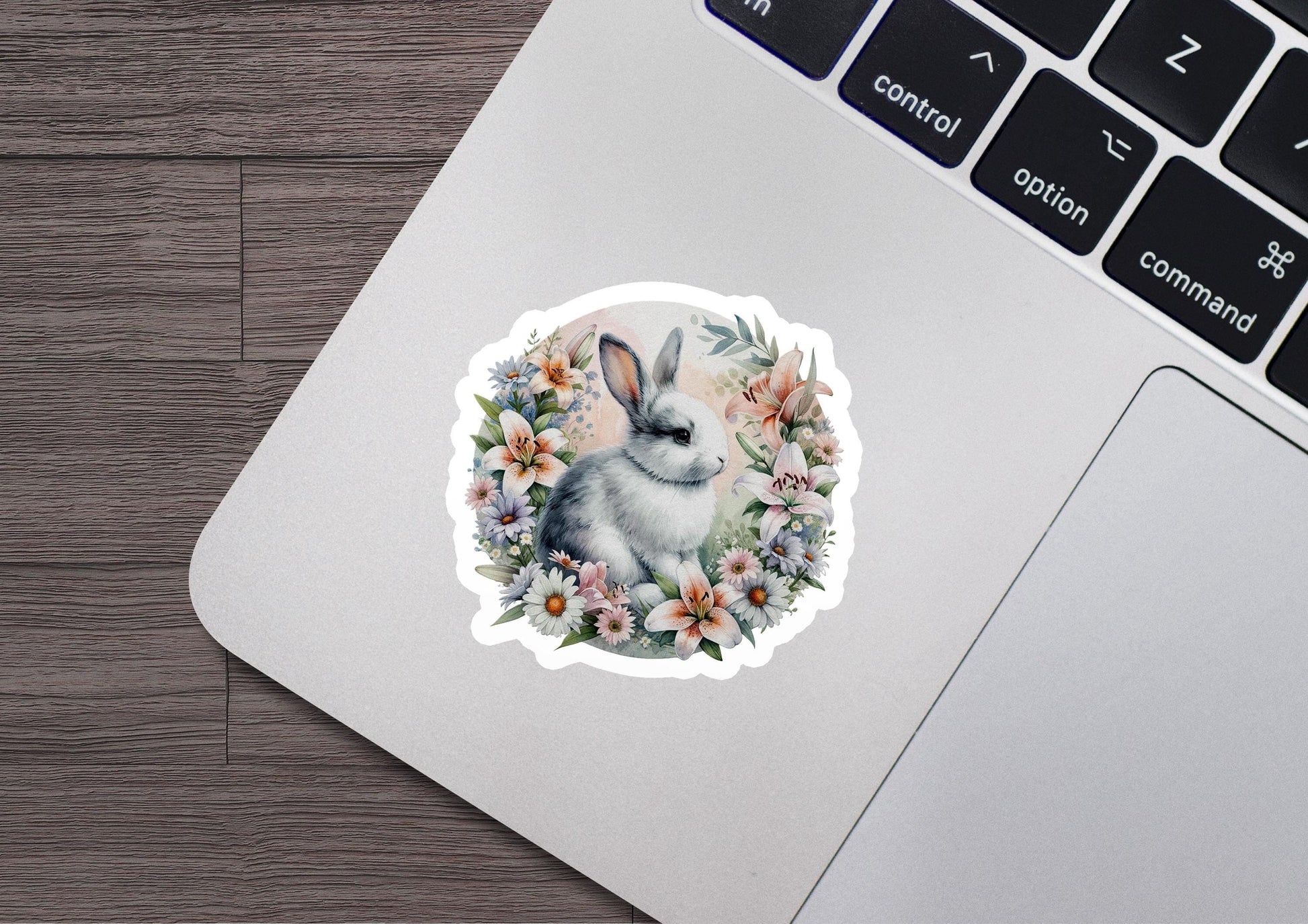 a sticker of a rabbit with flowers on it