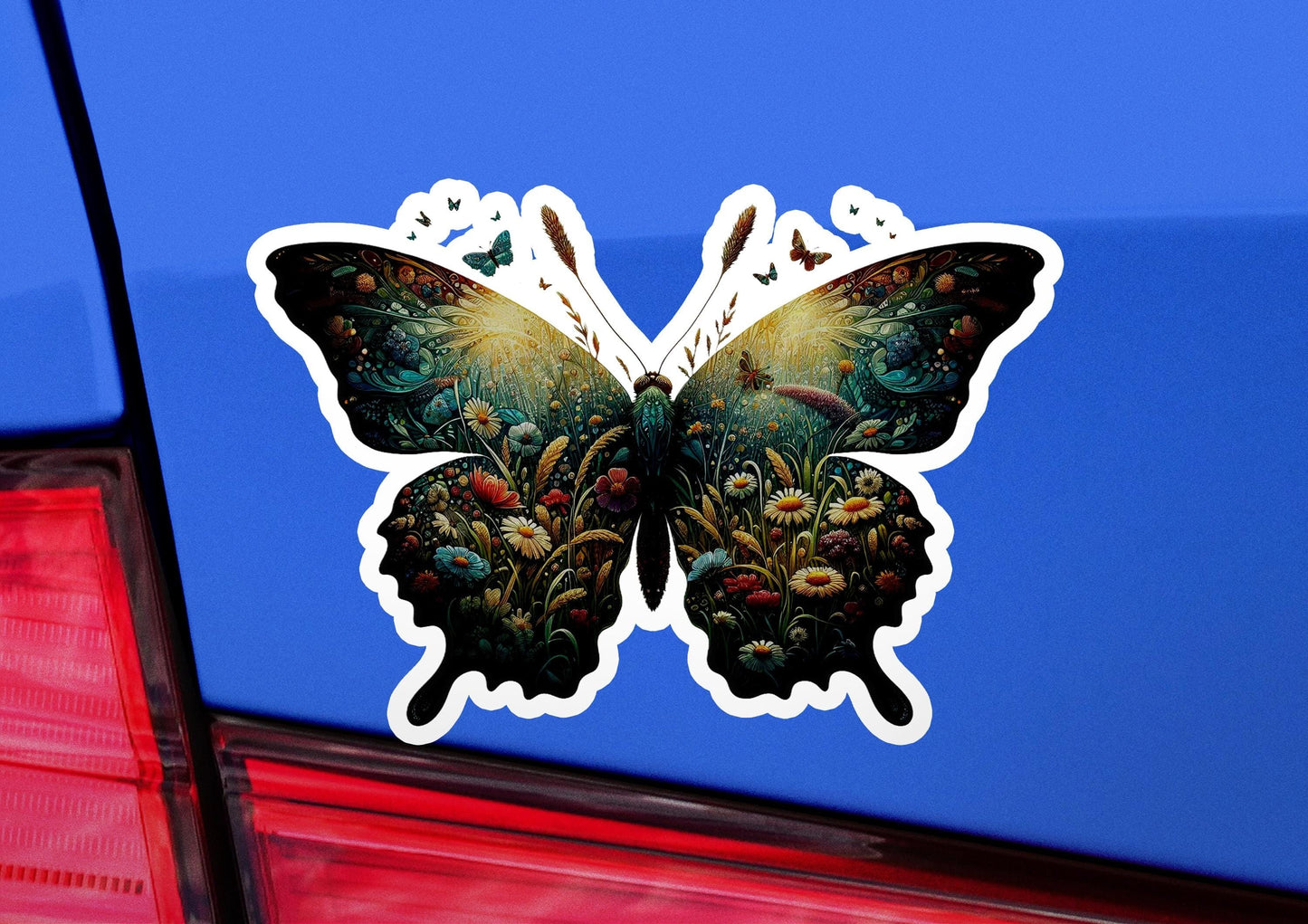 a butterfly sticker on the back of a car