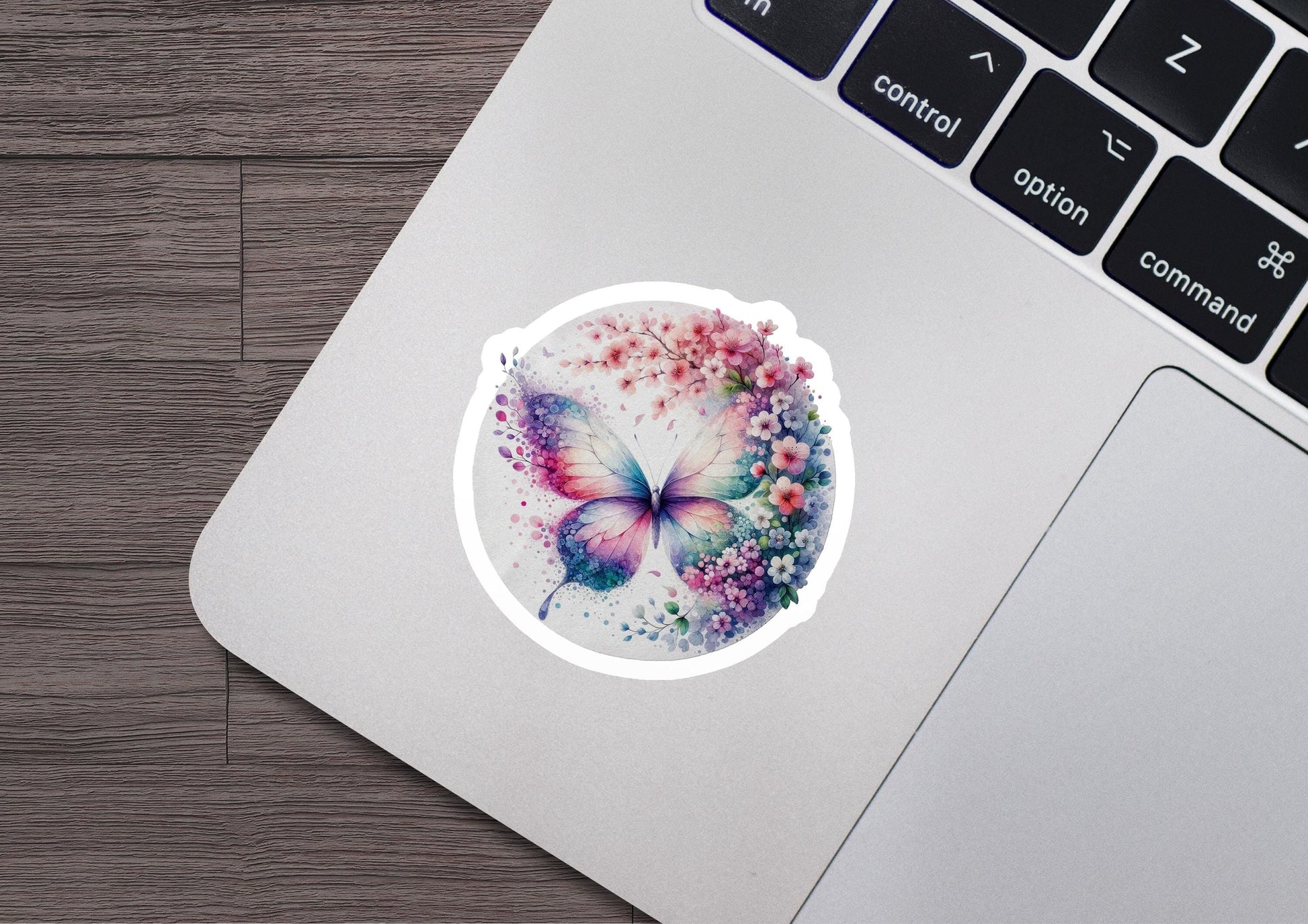 a laptop with a sticker of a butterfly on it