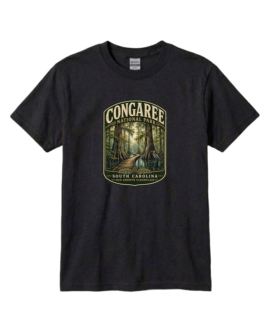 A black t-shirt with a graphic design depicting a forest scene with a path leading through it, surrounded by trees.