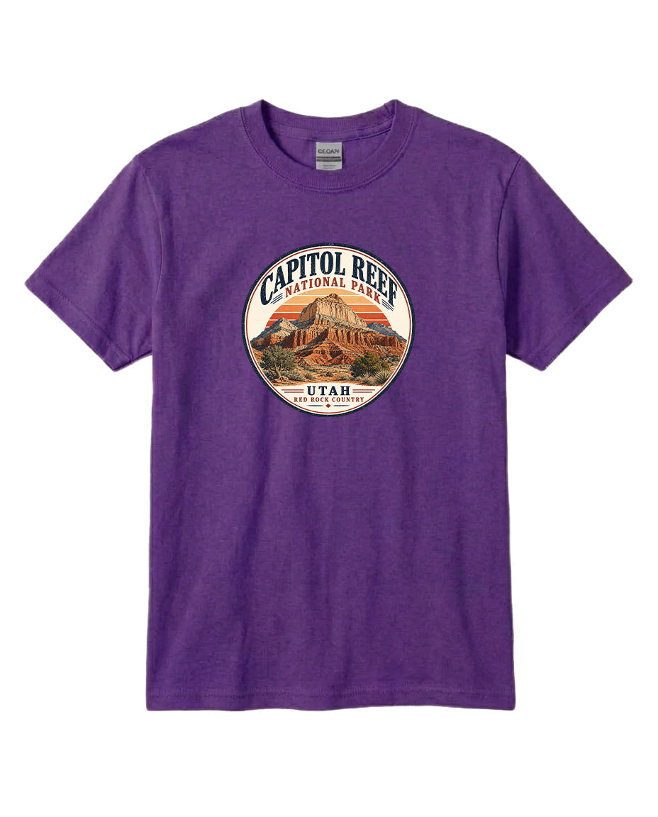 A purple t-shirt with a circular graphic design featuring the Capitol Reef National Park in Utah.