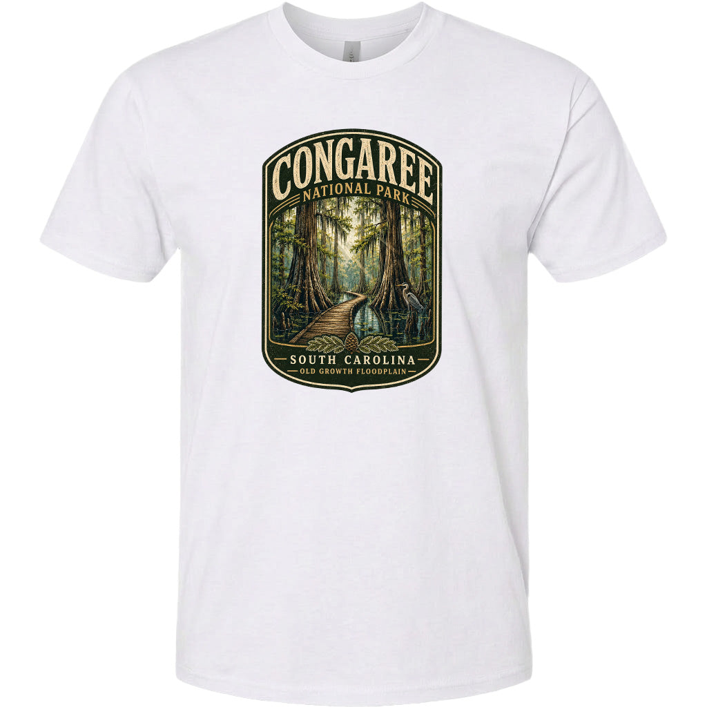 A white t-shirt with a graphic design depicting a forest scene with a path leading through it, surrounded by trees and foliage.