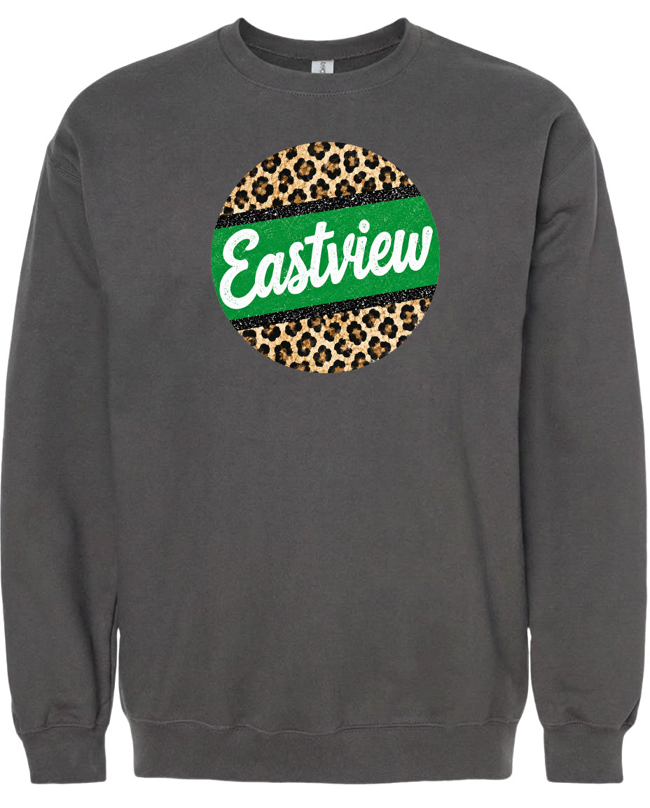 A gray sweatshirt with a circular design featuring a leopard print pattern and the word "Eastview" written in green text.
