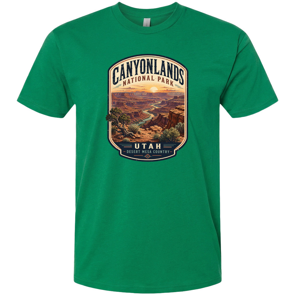 A green t-shirt with a graphic design depicting a scenic landscape of the Canyonlands National Park in Utah.