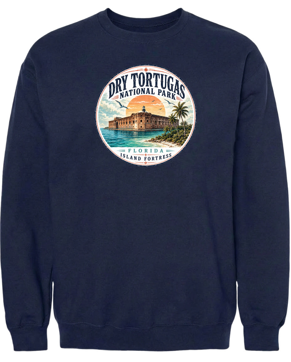 A navy blue sweatshirt with a circular graphic design featuring a building and palm trees, along with the text "Dry Tortugas National Park, Florida Island Fortress".