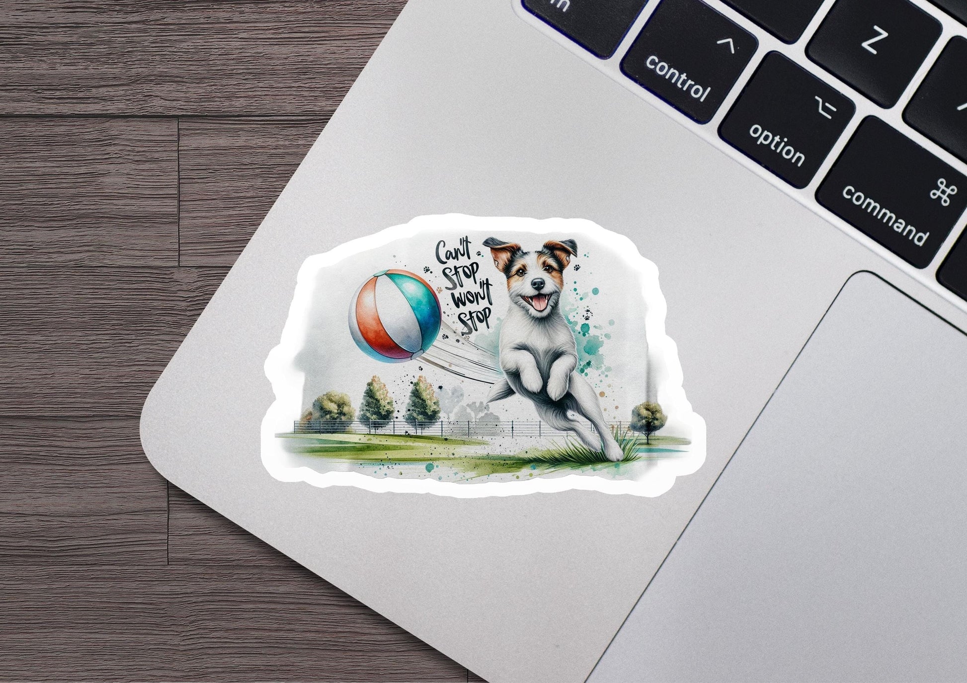 a sticker of a dog playing with a ball