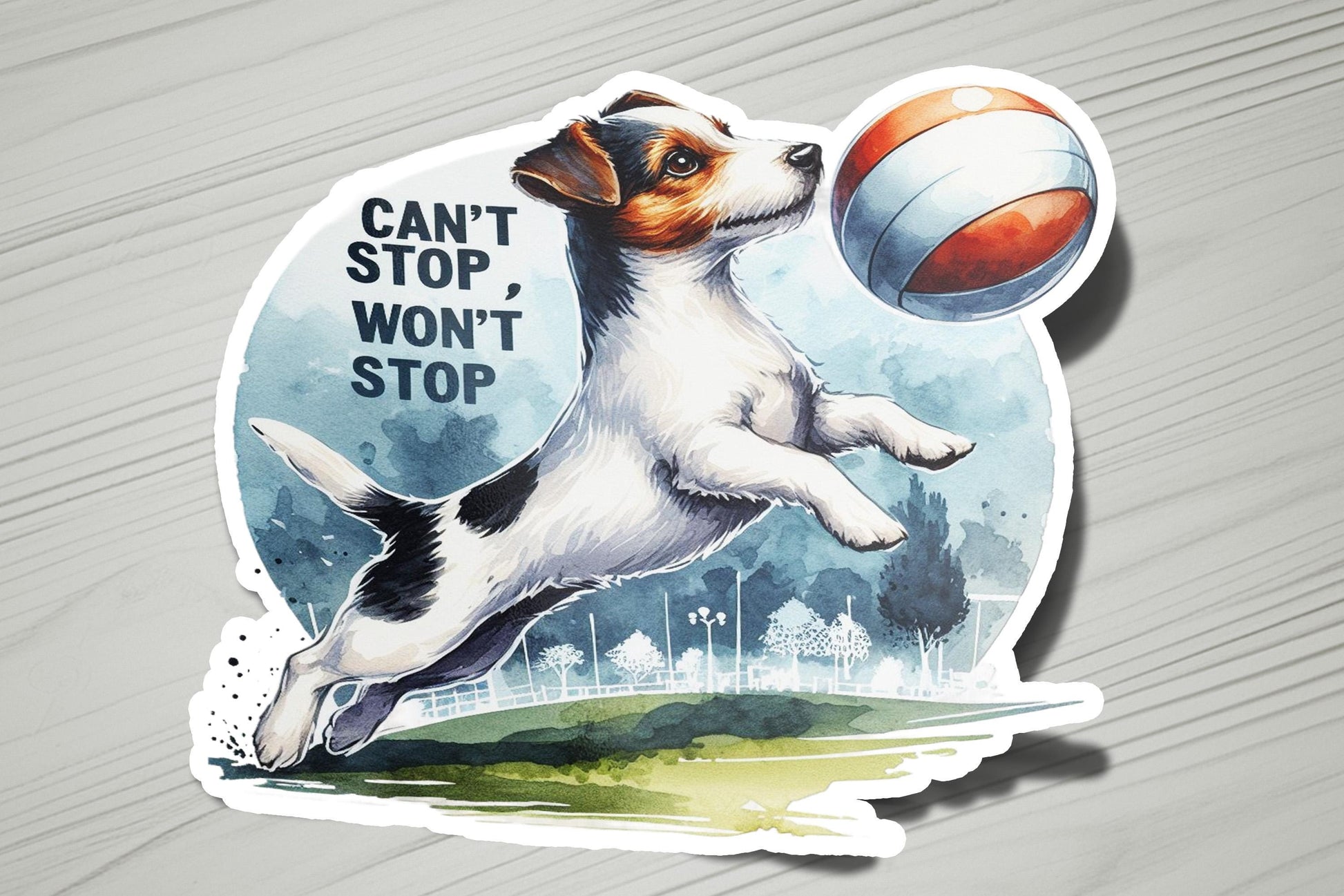 a sticker of a dog jumping to catch a ball