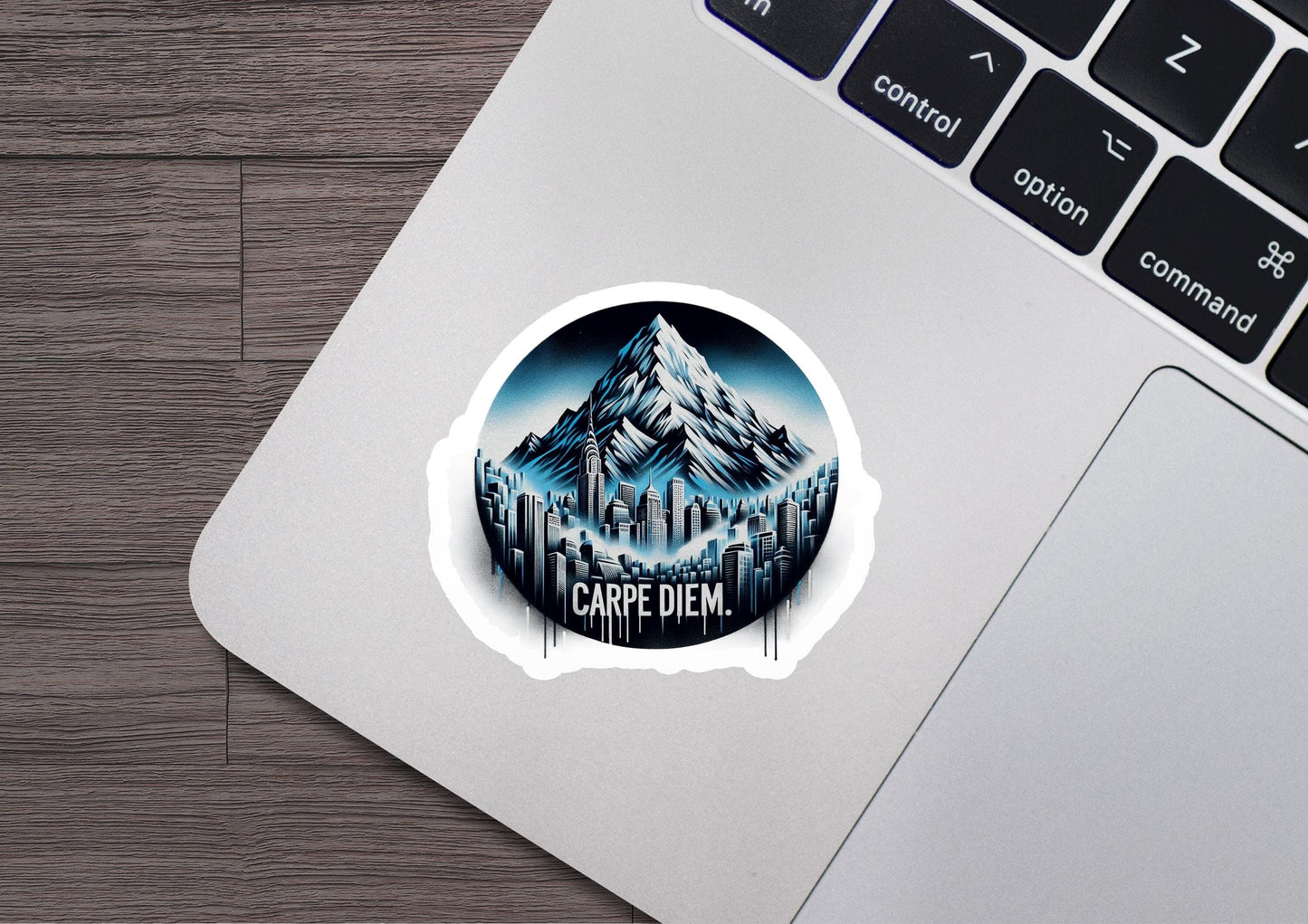 a laptop with a sticker of a mountain on it