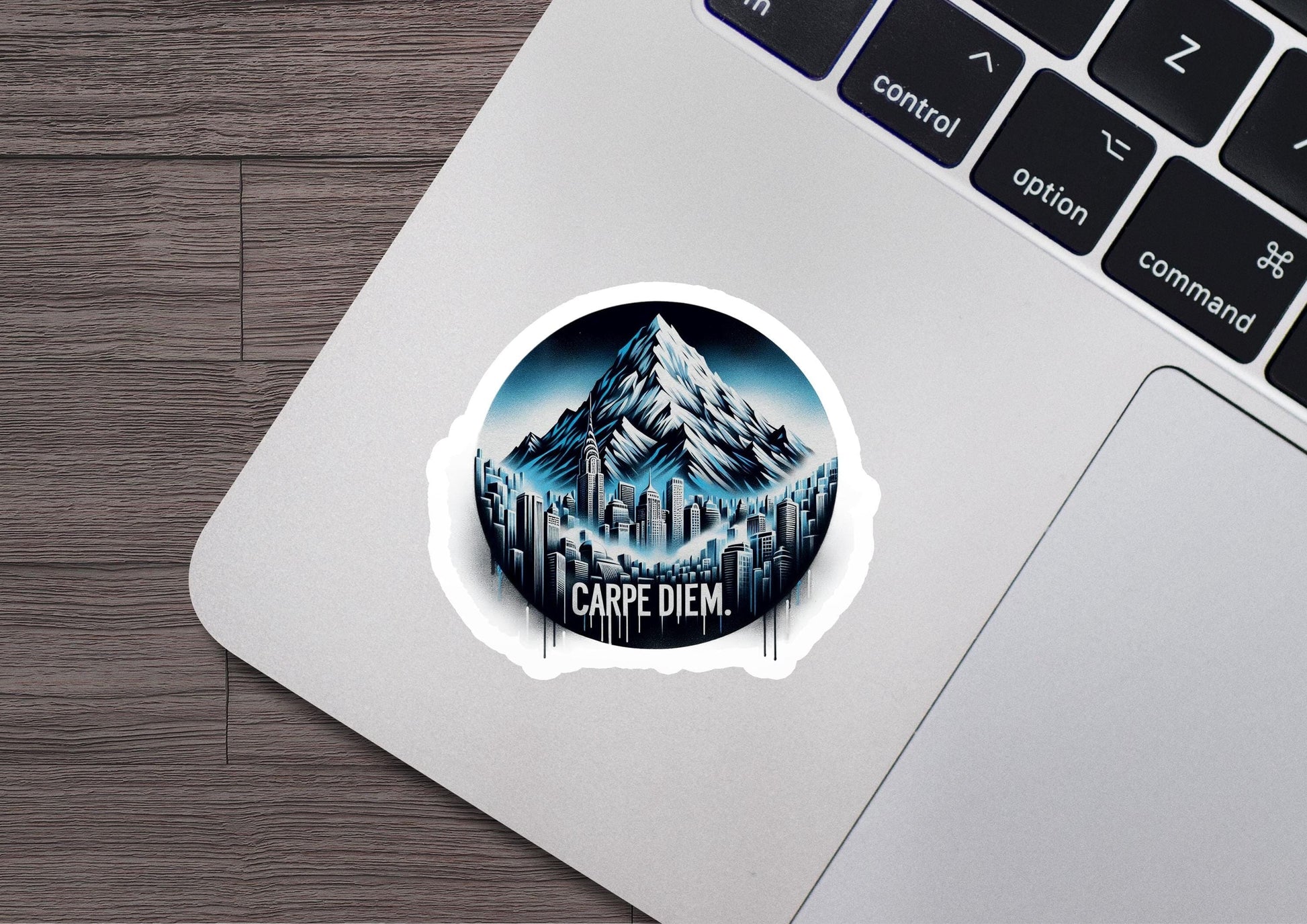 a laptop with a sticker of a mountain on it