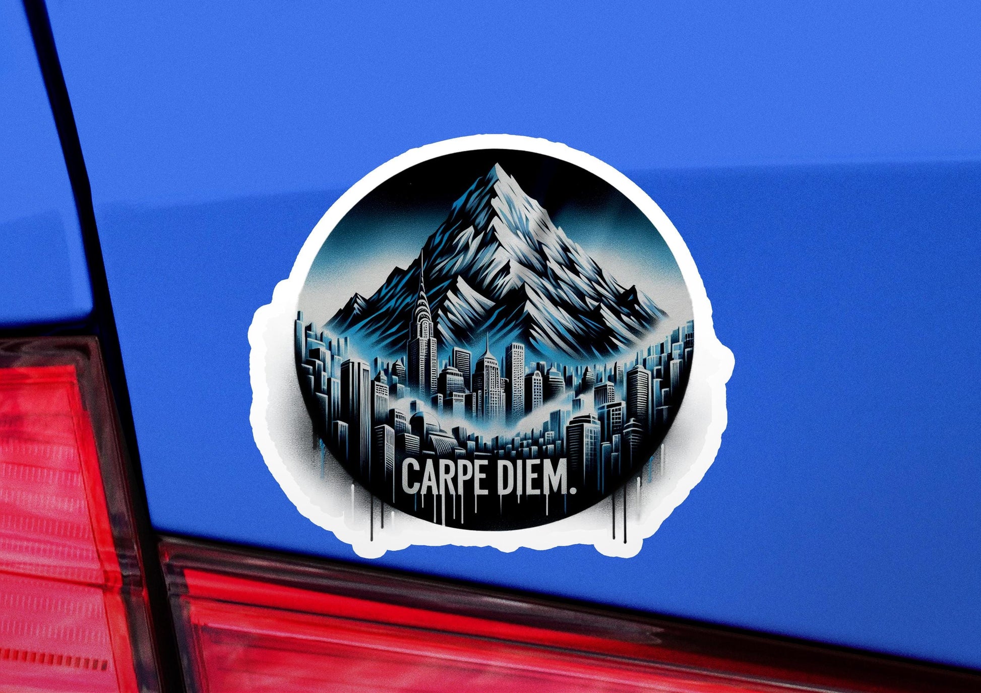 a sticker on the back of a car with a picture of a mountain