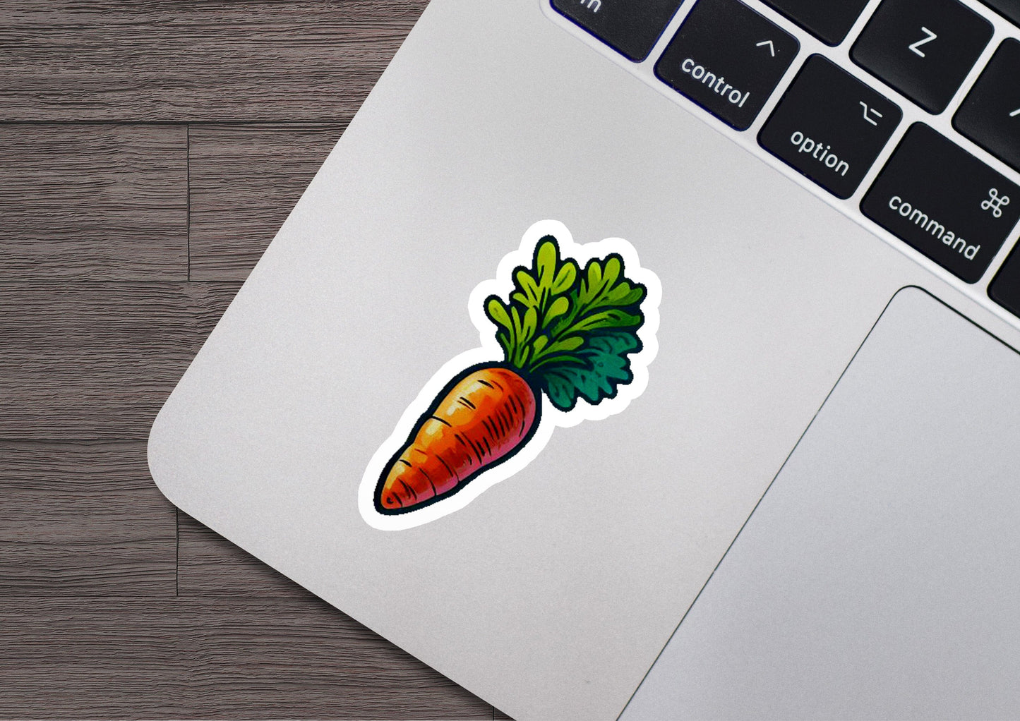 a sticker of a carrot on a laptop