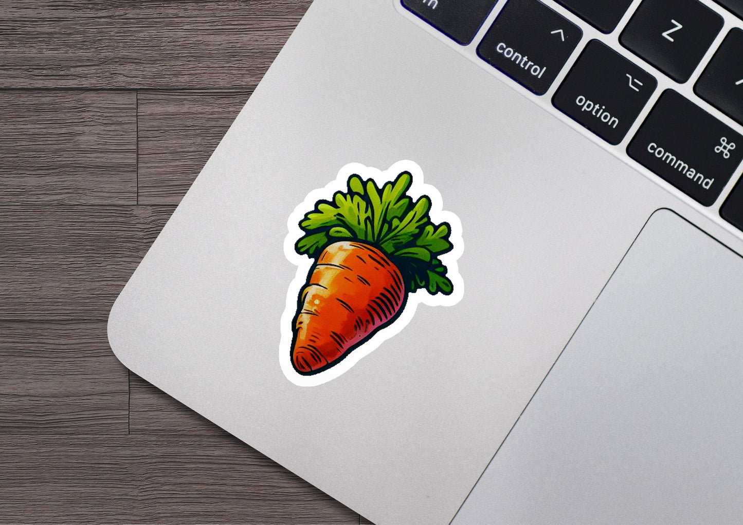 a sticker of a carrot on a laptop