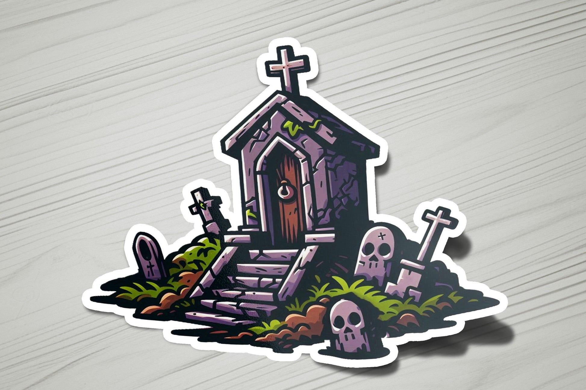 a sticker of a house with a graveyard and a cross
