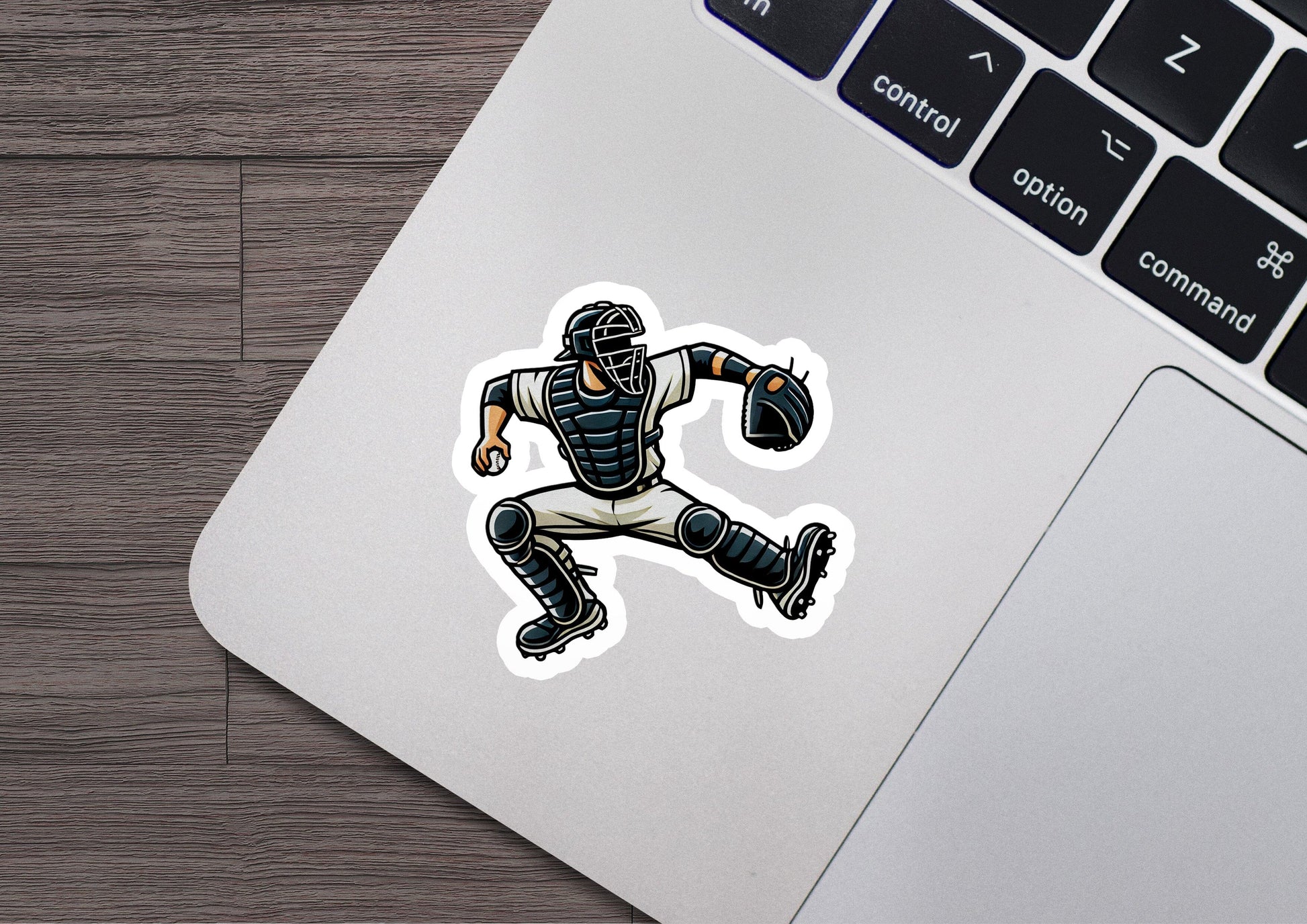 a laptop with a sticker of a baseball player