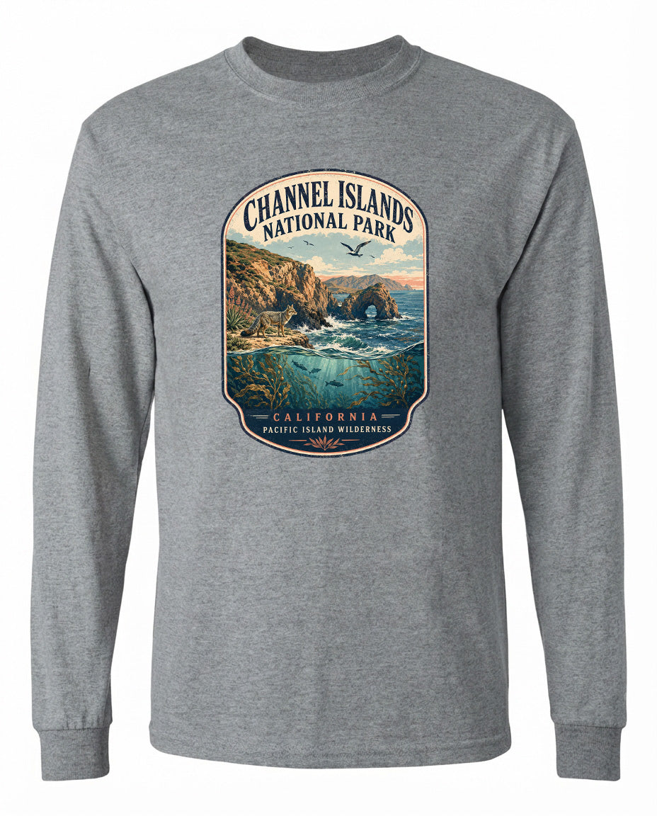 A gray long-sleeved t-shirt with a graphic design depicting a scenic coastal landscape with cliffs, water, and a bird in flight.