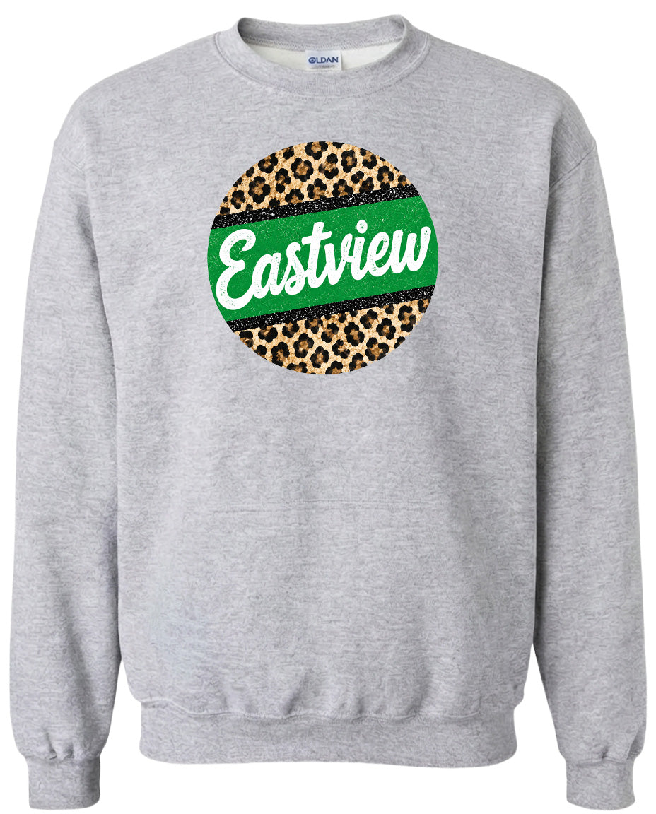 A gray sweatshirt with a circular design on the front featuring a leopard print pattern and the word "Eastview" written in white text.