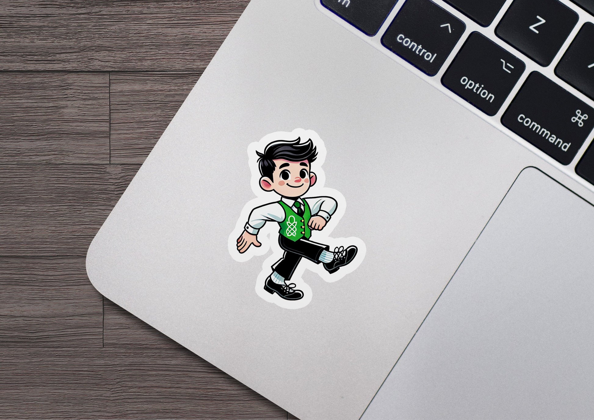 a laptop with a sticker of a man in a green shirt