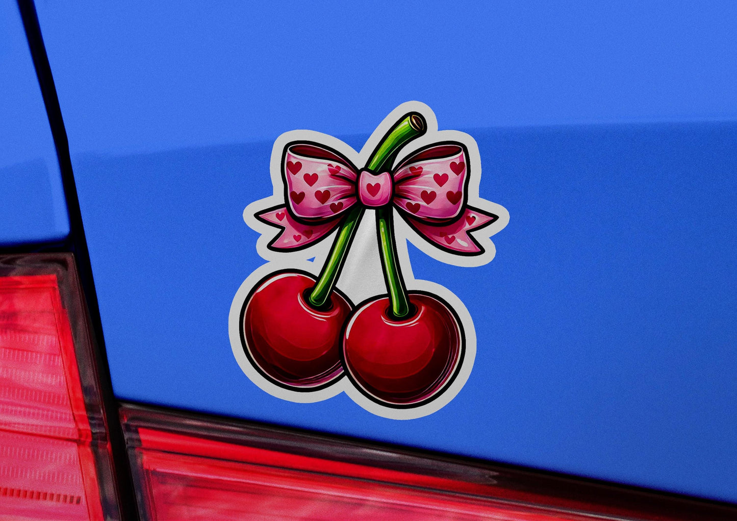 a sticker of a cherry with a bow on it