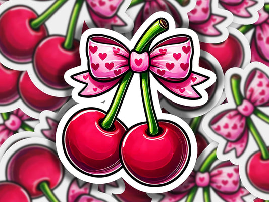 a sticker with a bow and two cherries on it