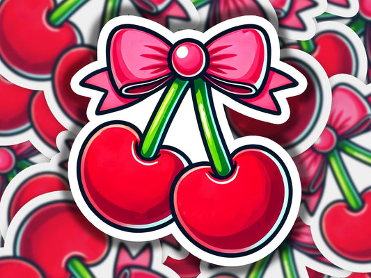 a sticker of cherries with a bow on it