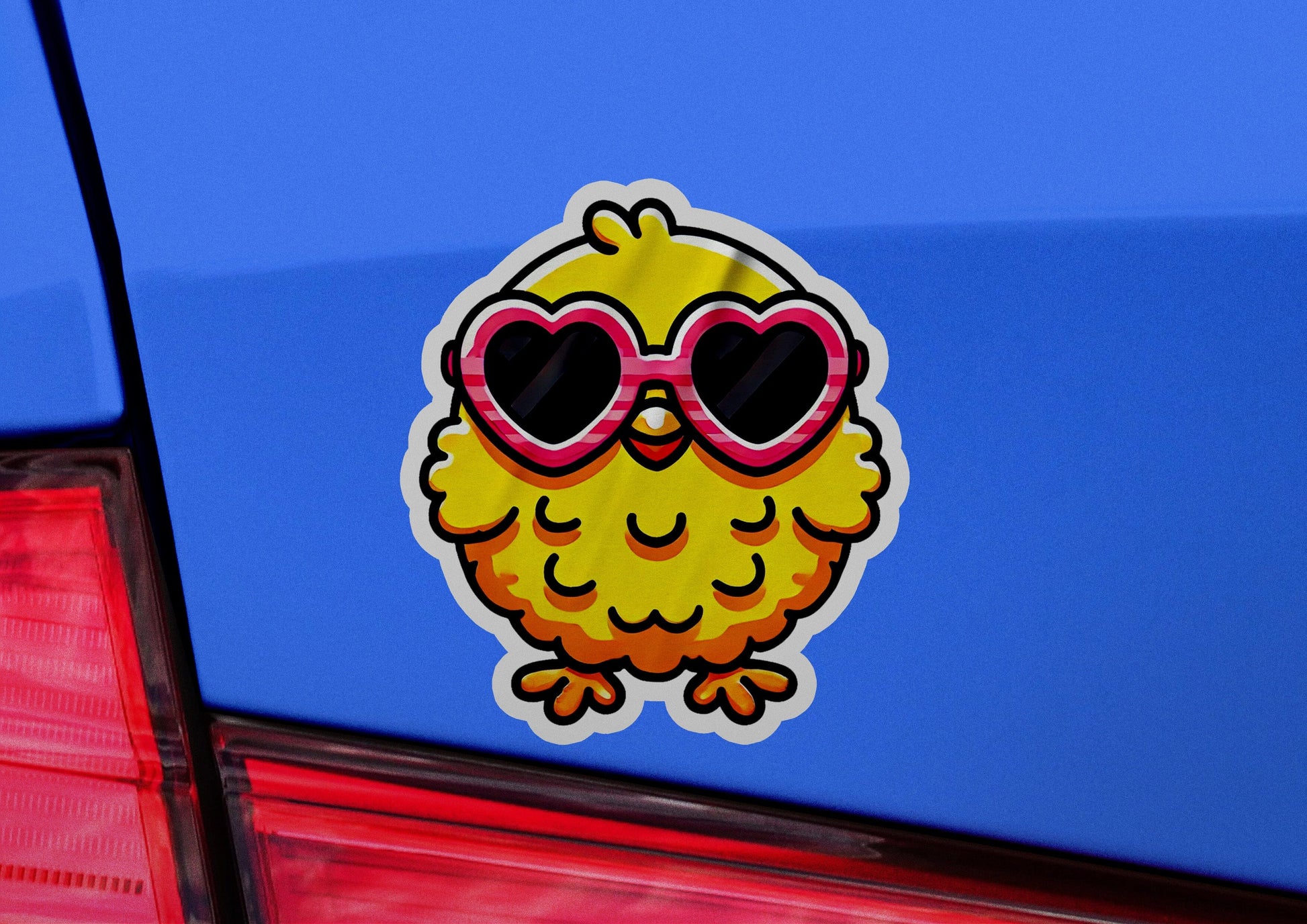 a sticker of a yellow bird with heart shaped sunglasses