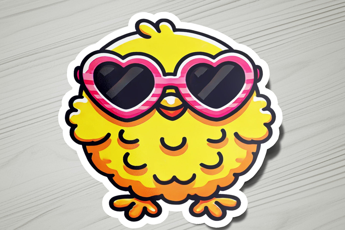 a sticker of a yellow bird with heart shaped sunglasses