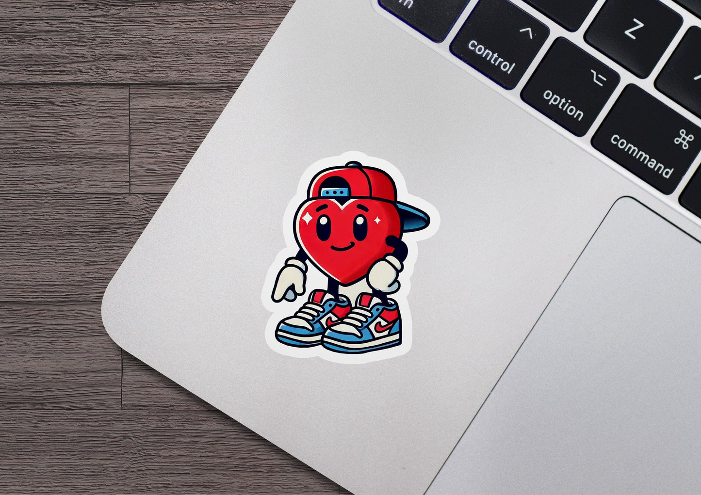 a laptop with a sticker of a heart on it