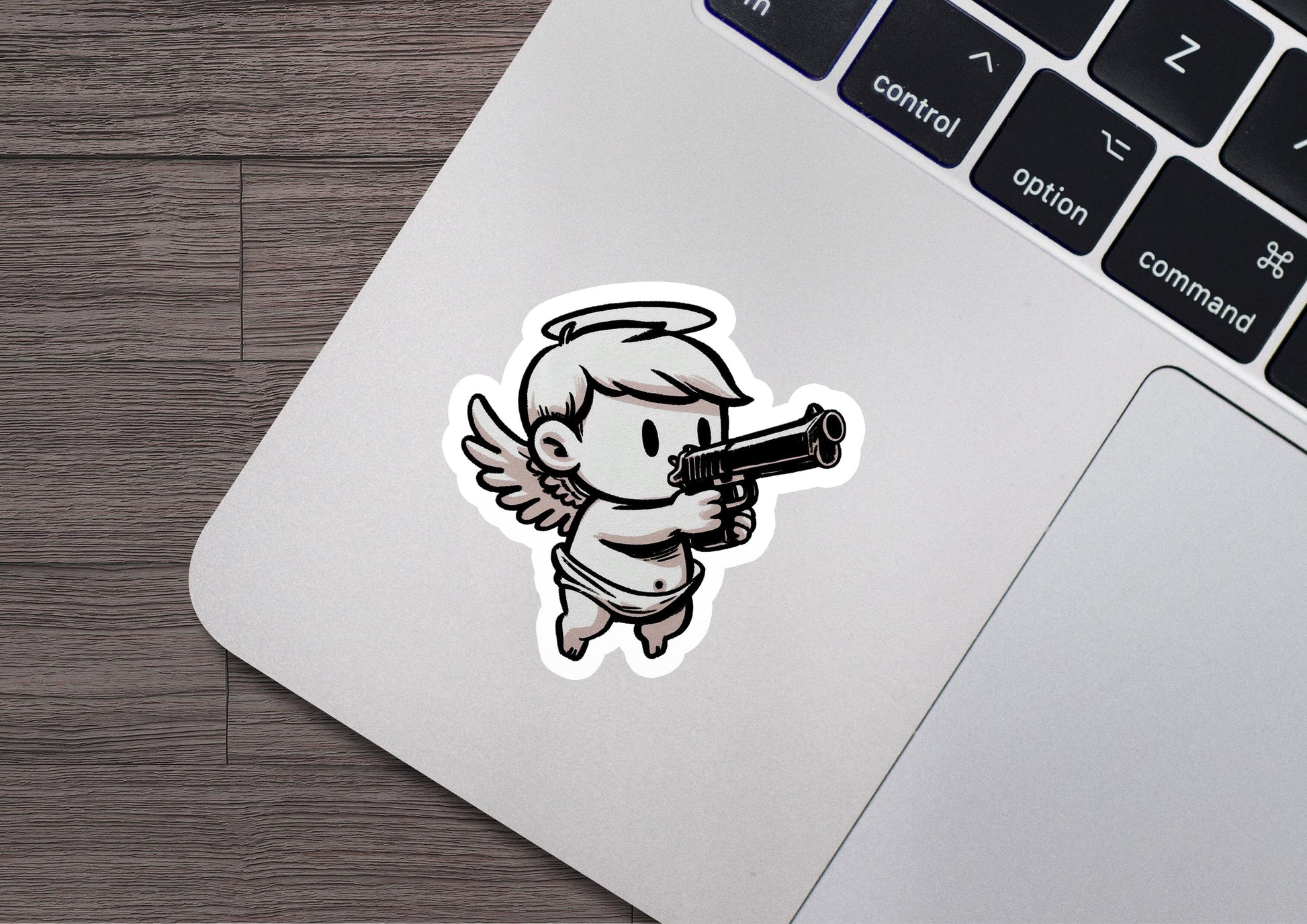 a sticker of an angel holding a gun