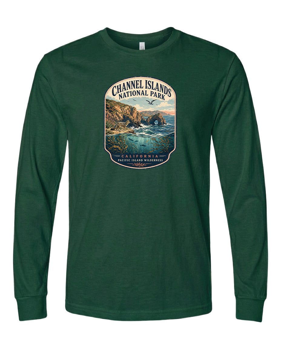 A green long-sleeved t-shirt with a graphic design depicting a scenic coastal landscape, including cliffs, water, and a sunset.