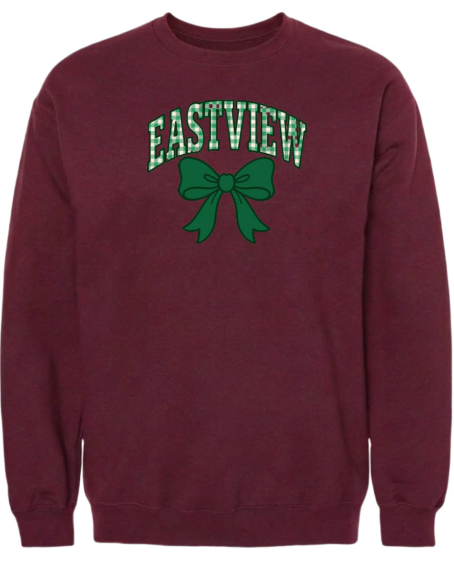 A burgundy sweatshirt with a green bow and the word "EASTVIEW" printed on it.