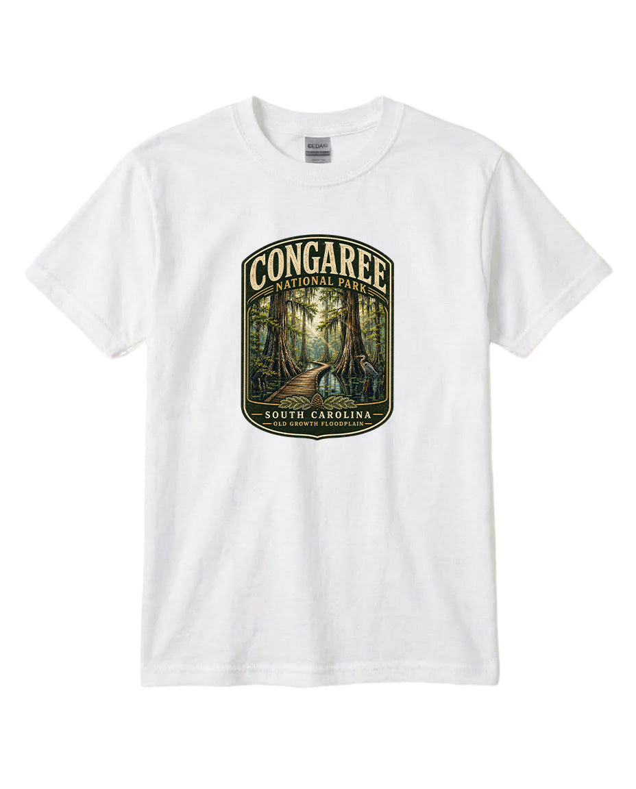 A white t-shirt with a graphic design depicting a forest scene with a path leading through it, surrounded by trees.