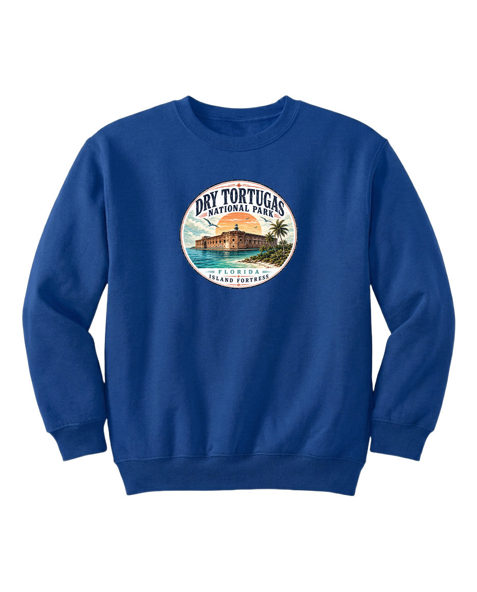 A blue sweatshirt with a circular logo that says "Dry Tortugas National Park" and features an illustration of a tropical beach and palm trees.