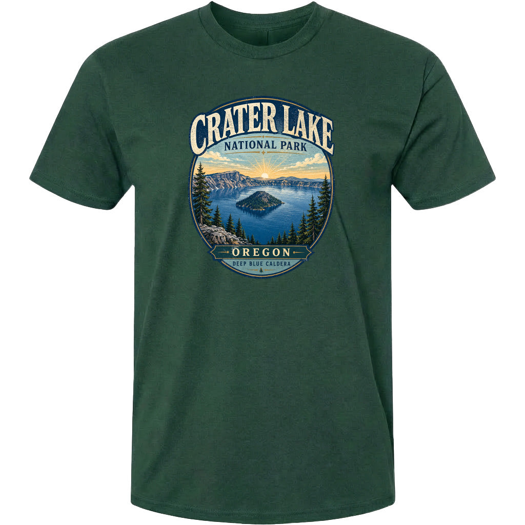 A green t-shirt with a graphic design depicting Crater Lake National Park in Oregon, featuring a scenic landscape with a lake, mountains, and pine trees.