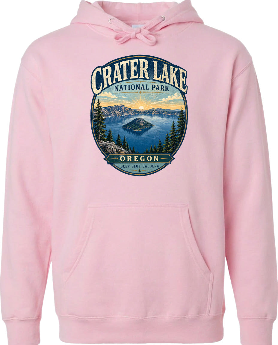 A pink hoodie with a graphic design depicting Crater Lake National Park in Oregon.