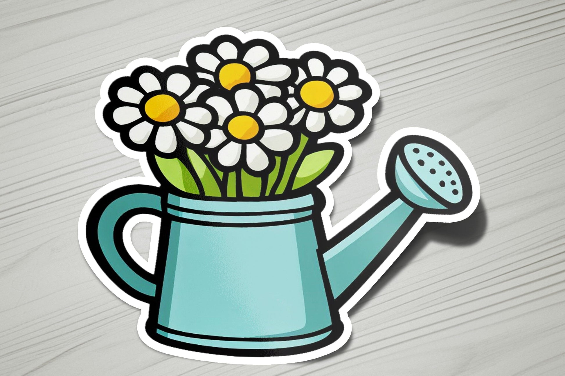 a sticker of a watering can with flowers in it