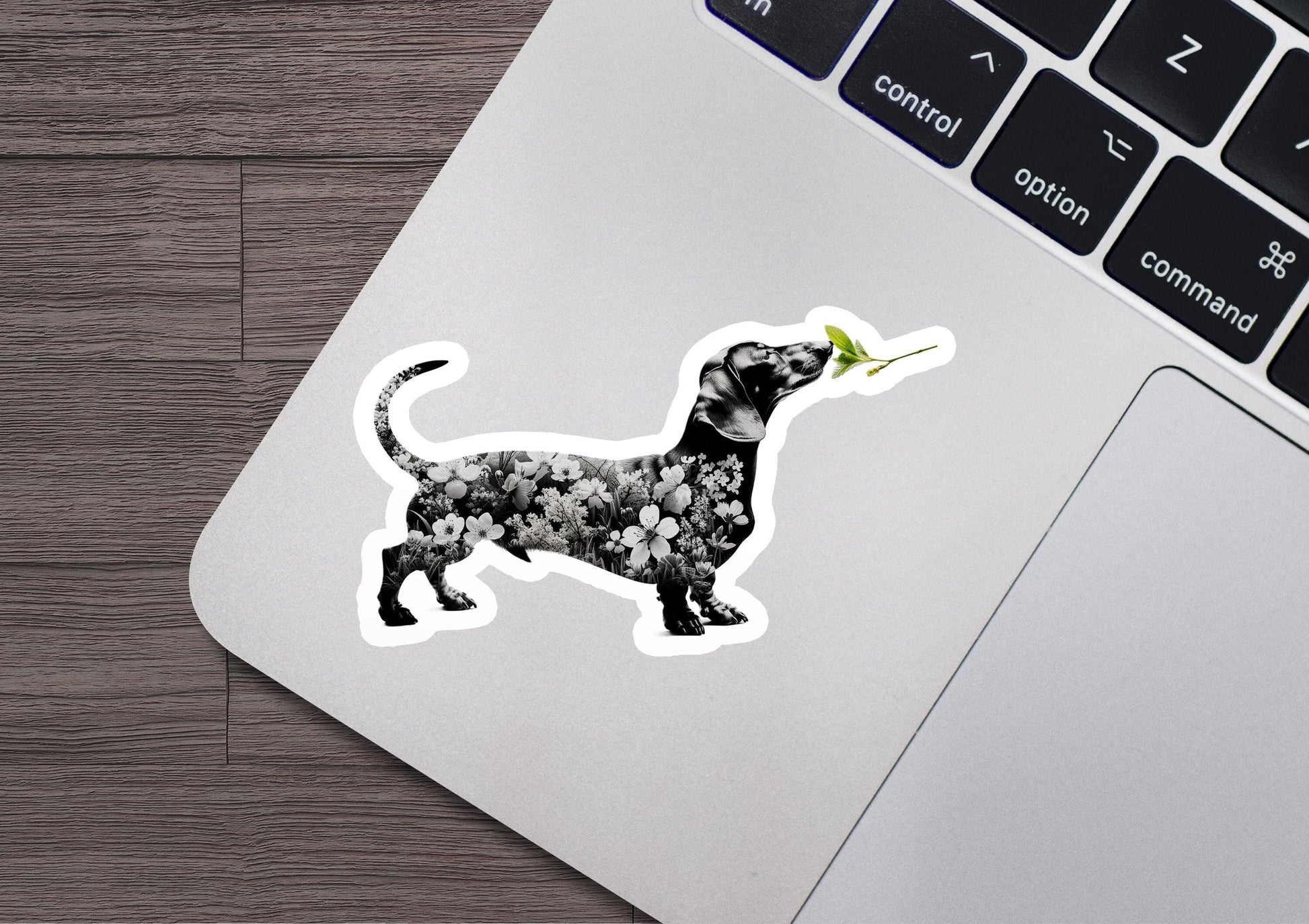 a sticker of a dog with a flower in its mouth