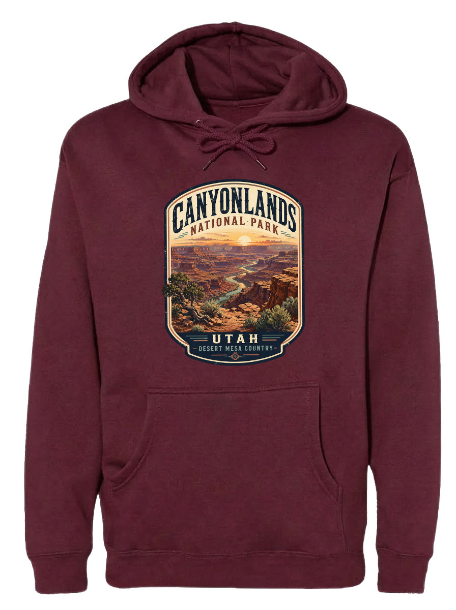 A burgundy hoodie with a graphic design depicting the scenic landscape of Canyonlands National Park in Utah.