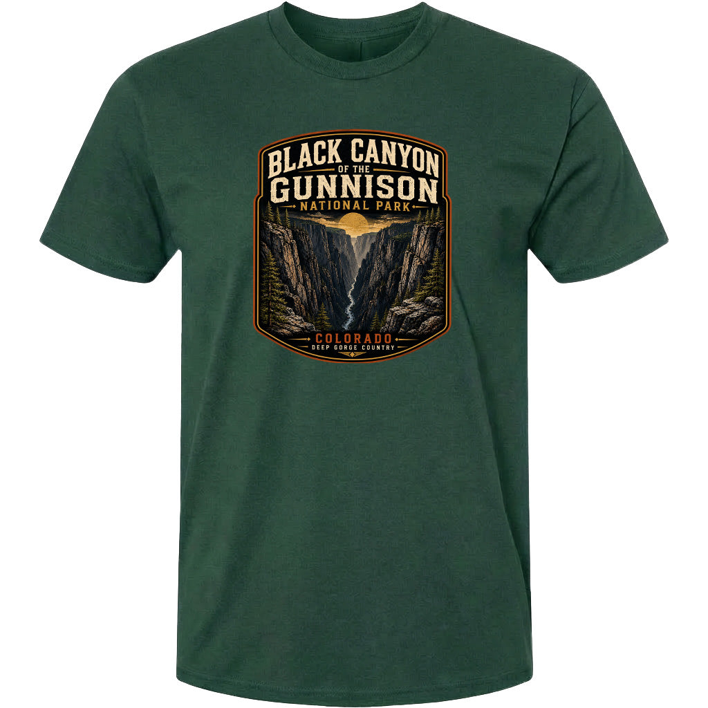 A green t-shirt with a graphic design depicting the Black Canyon of the Gunnison National Park in Colorado.