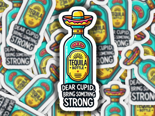 a bottle of tequila sitting on top of a pile of stickers