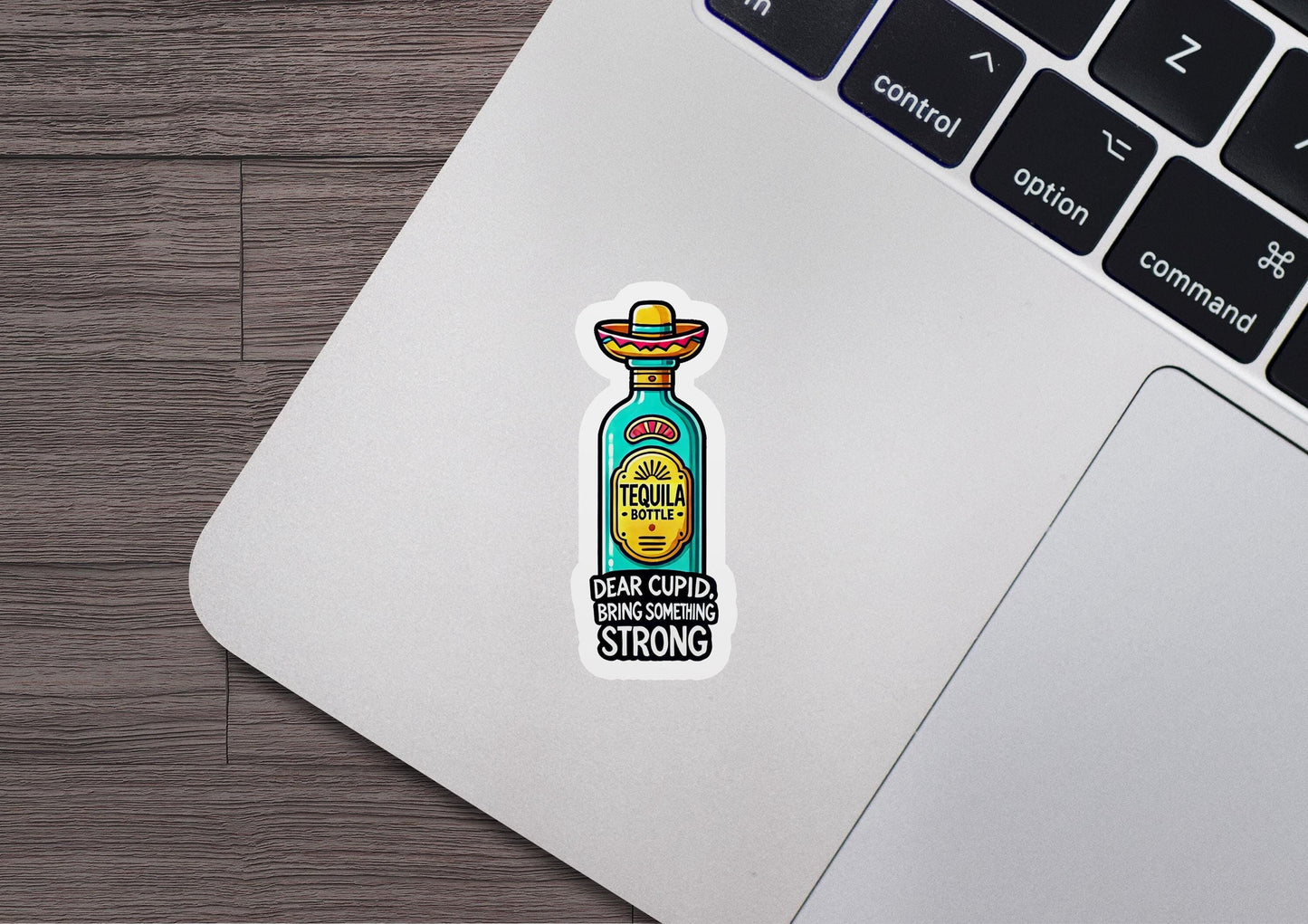 a laptop with a sticker of a bottle on it