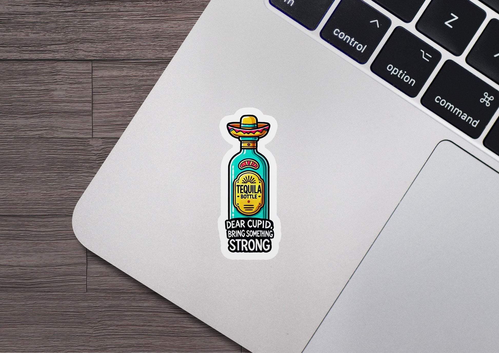 a laptop with a sticker of a bottle on it