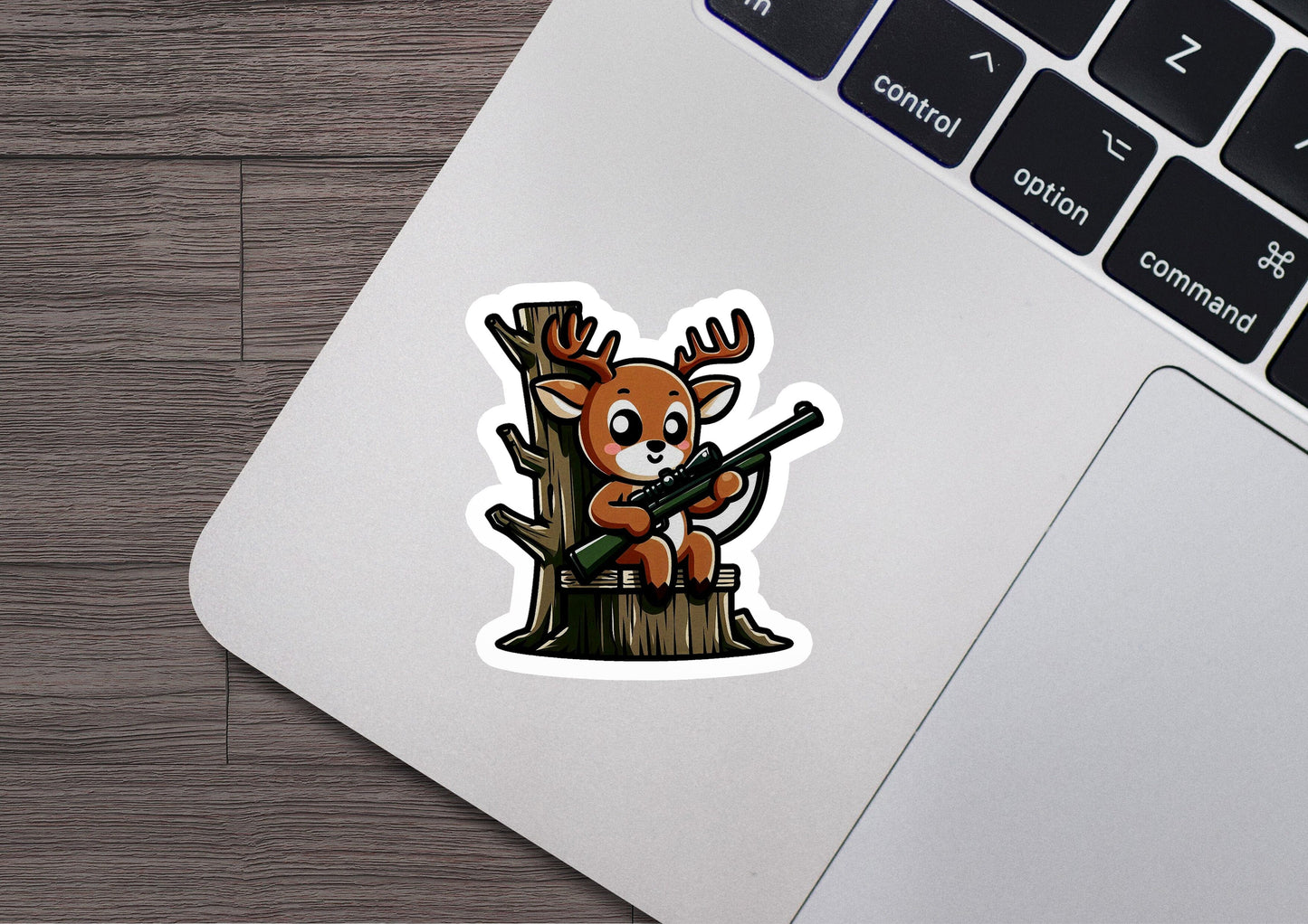 a sticker of a deer sitting on top of a tree