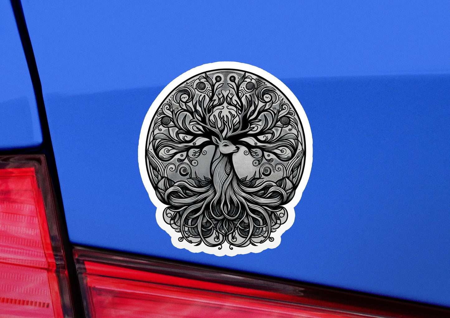 a sticker of a tree of life on a blue car