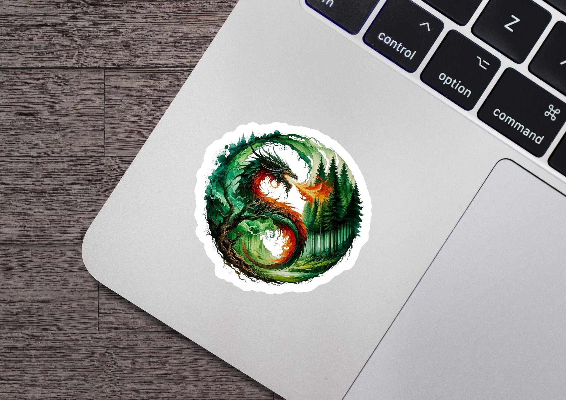 a laptop with a sticker of a dragon on it