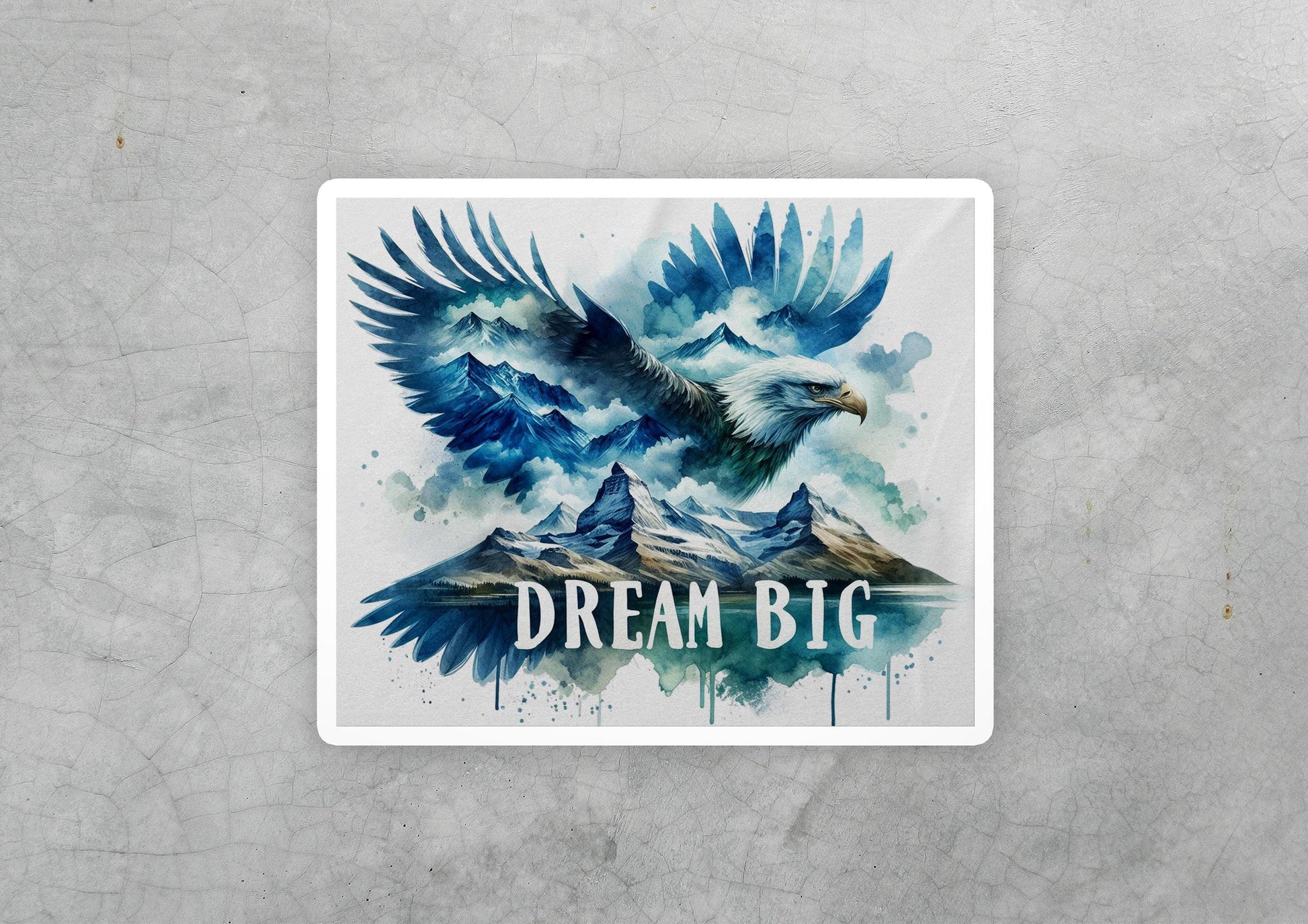 a sticker with a picture of an eagle flying over mountains
